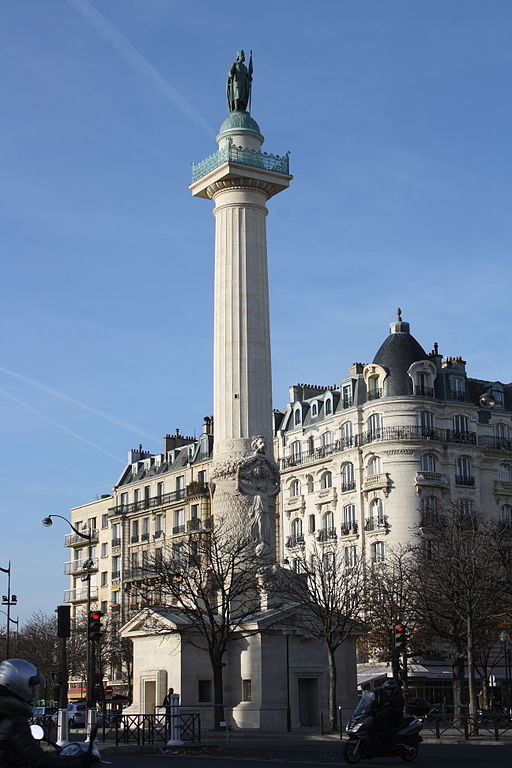 Stone column topped with bronze statue