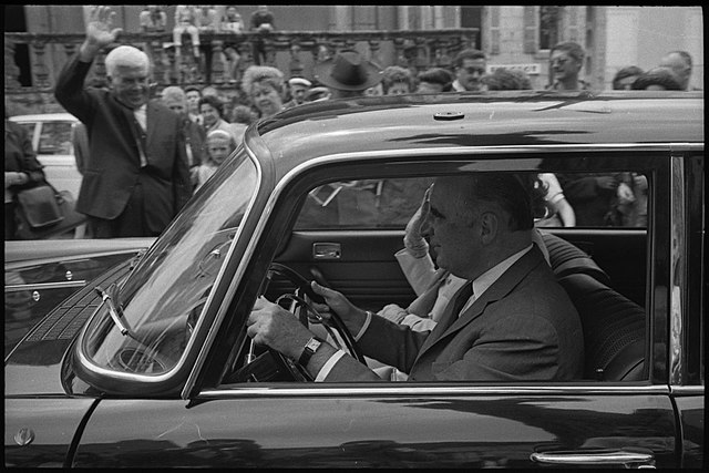 Georges Pompidou at the wheel of a car