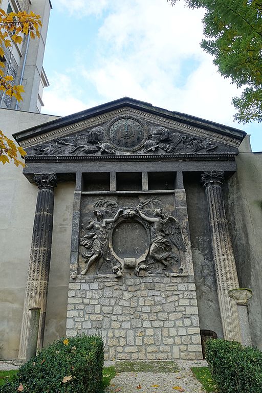 Partially blackened stone carving and columns