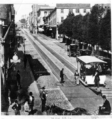 Black and white photograph showing an incline with two sets of tramway tracks with a tram at the bottom