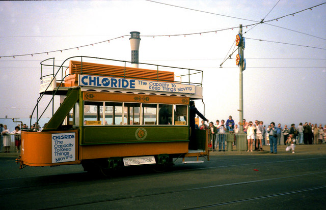 A yellow- and green-painted tram